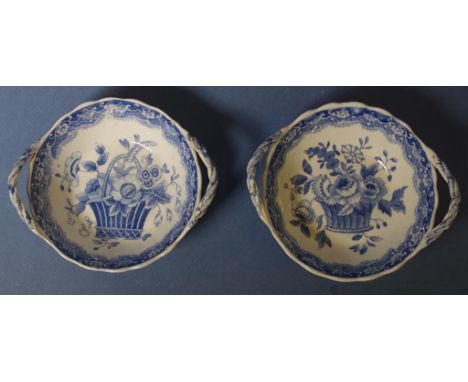 Two Spode two handle bowls both with plaited handles. Both blue and white basket of flowers patterns. Each with printed mark 