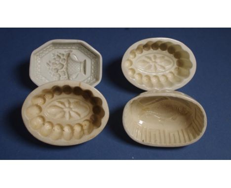 Four antique Spode jelly moulds one with vase and flowers impressed internal pattern; another with fish pattern, etc. All as 