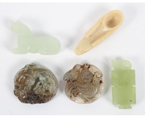 Six pieces of 20th century Chinese carved jade and jadeite. Including a dog in pale celadon colour, two bi discs or pendants,