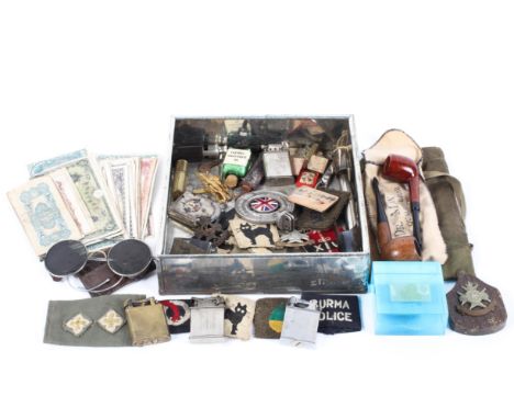 An assortment of mixed collectables, including a Dunhill lighter, early goggles, car mascot, military badges, police etc