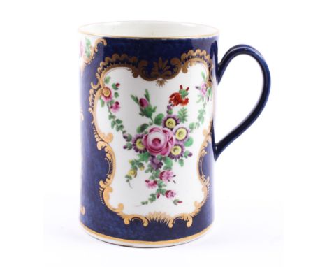 A Worcester porcelain blue scale ground cylindrical tankard, circa 1775. With blue crescent mark, painted with loose flower s