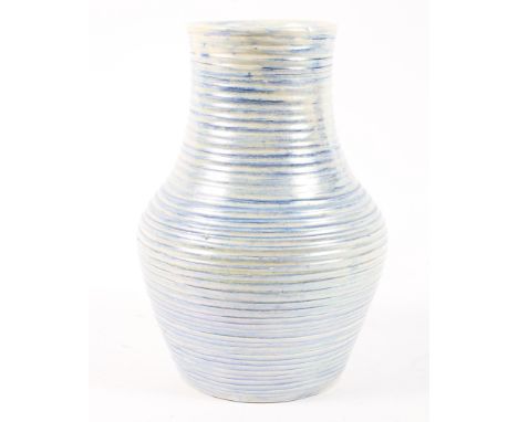 A Moorcroft blue ribbed lamp base, in lustrous finish. The underside with printed and impressed marks, original label, with a