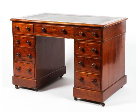 A Victorian mahogany twin pedestal kneehole desk. Bearing brass label for James Phillips Furnisher, Union Street, Bristol, wi