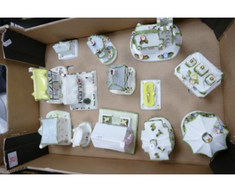 A collection of Coalport China Cottages to include: Park Lodge, Village Church, The Gate House, Keepers Cottage etc, some wit