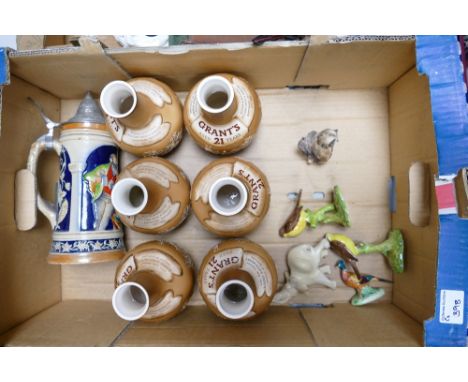 A mixed collection of items to include: large German Goebel Beer Stein, Bells Grants Pottery Advertising Decanters etc 