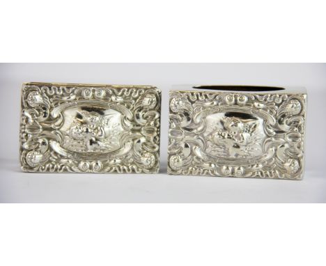 Two hallmarked silver items decorated with cherubs. Snuff box and matchbox cover, size 6.5 x 4cm.