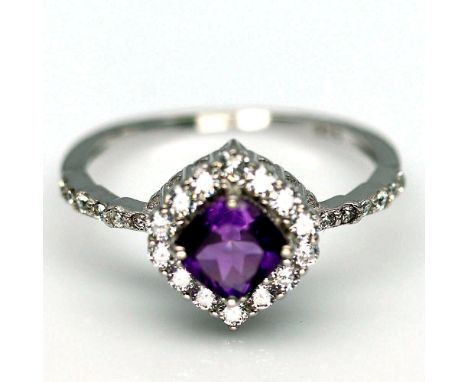 A 925 silver cluster ring set with a cushion cut amethyst and white stones, (S).