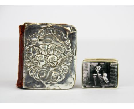 A hallmarked silver fronted miniature hymnal, 4.5 x 5cm. together with a sterling silver and enamel pill box, gross weight ap