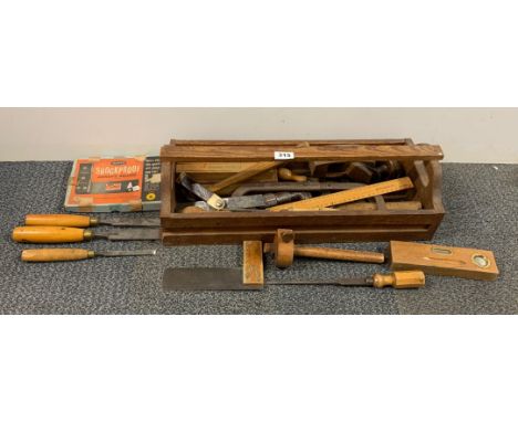A vintage toolbox and contents.