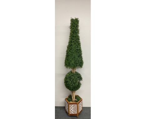A wood and ceramic tile planter with large artificial topiary, H. 195cm.
