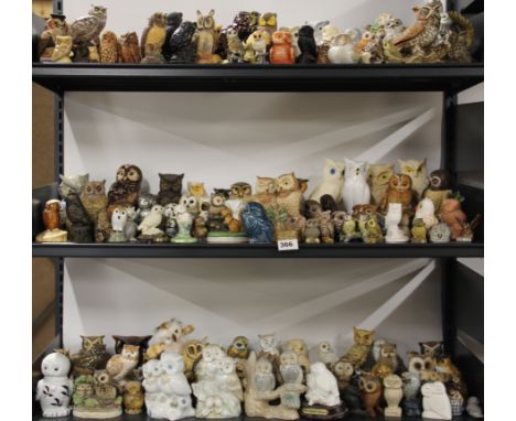 A large collection of ceramic and other owl figures