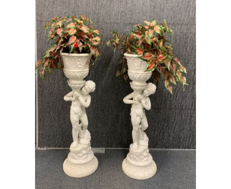 A pair of white ceramic cherub plant holders, H. 97cm.