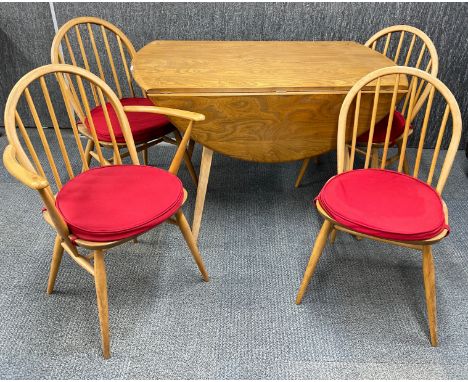 An Ercol oval drop leaf dining table, 112 x 120cm, together with four chairs, including one carver.