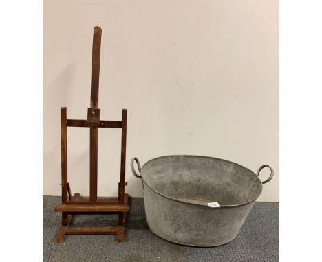 A zinc bath, W. 59cm, together with a small artists easel and an artists two drawer chest.