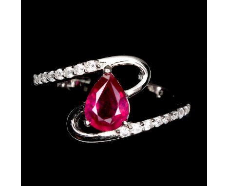 A 925 silver ring set with a pear cut ruby and white stones, (L.5).