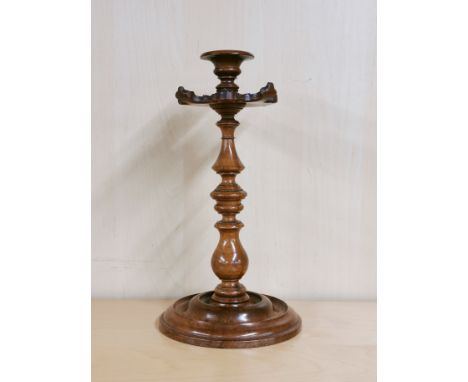 A lovely 19th C carved walnut candlestick, H. 27cm.