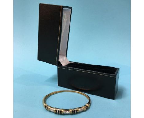 A 9ct gold bangle, 10.8g