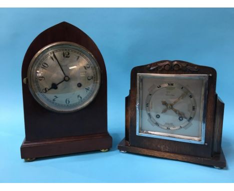 A mahogany bracket clock and an oak cased clock