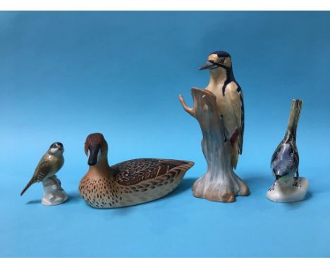 A Spode 'Greater Spotted Woodpecker', a Royal Doulton 'Pintail' and two other birds