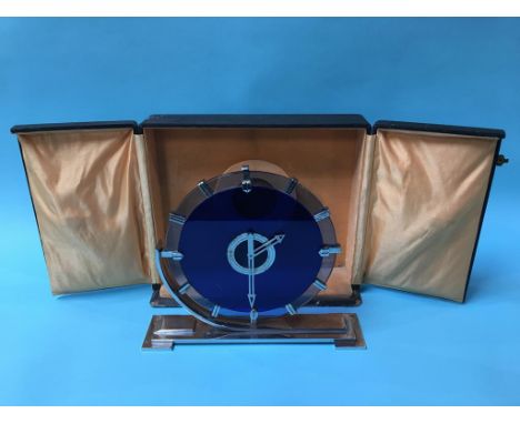 An Art Deco two colour glass and chrome clock by Goldsmiths and Silversmith Co. Ltd, Regent Street, London, 8 day movement, n