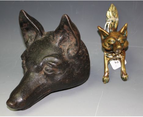 An early 20th century cast iron fox head wall plaque, a fox head brass door knocker (2)