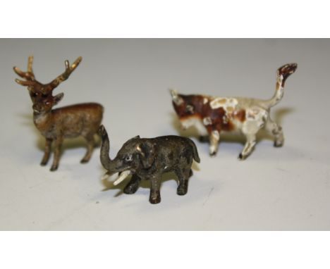 An early 20th century miniature Austrian cold painted metal model elephant, trunk erect, 25mm long; others stag, 23mm high, c