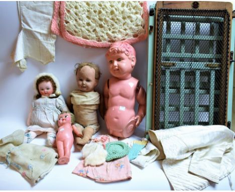 A 1930's/40's painted cloth doll; another similar; a 1950's/60's Japanese celluloid boy doll; a Kewpie doll; other celluloid 