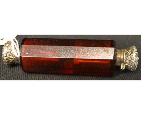 A Victorian ruby glass double ended scent, white metal tops to each end