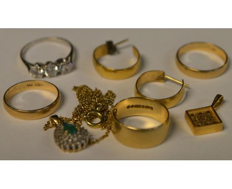 A pair of 14ct gold wedding bands, 4.1g gross; another, 9ct; a cubic zirconia trilogy ring; pendants; other yellow metal etc;