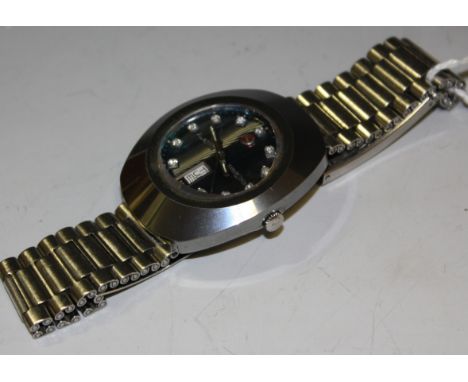 A retro Rado Diastar day/date wristwatch Condition Report: Currently running and hands and date can be set, cannot guarantee 