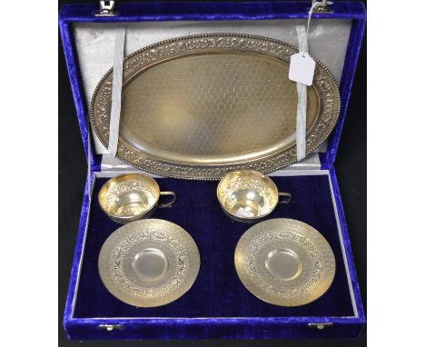 A pair of sterling silver tea cups and saucers on tray, marked 925, cased approx 28oz 