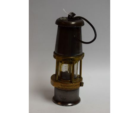 An early 20th century Wolf Safety Lamp Co, Wm Maurice Ltd, Sheffield, Baby Wolf miner's lamp no.1, 26cm high over handle