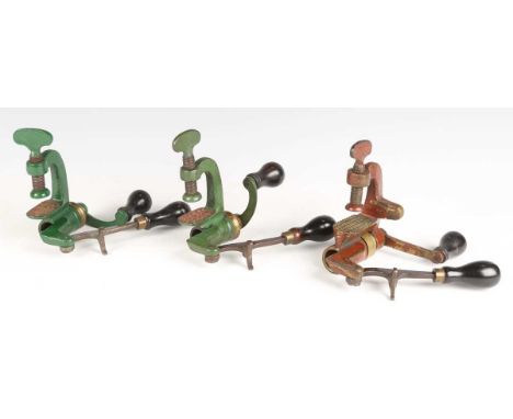 A group of three late 19th century roll turnover cartridge reloading tools by Bartram &amp; Co, comprising two red and green 