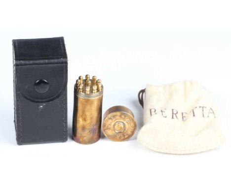 A late 20th century Beretta brass novelty butt or peg marker holder of shotgun cartridge form with screw-off percussion cap, 