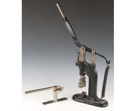 A scarce Macnaughton's Edinburgh Patent No. 35 steel and brass cartridge loading tool with spring-loaded mechanism and hinged