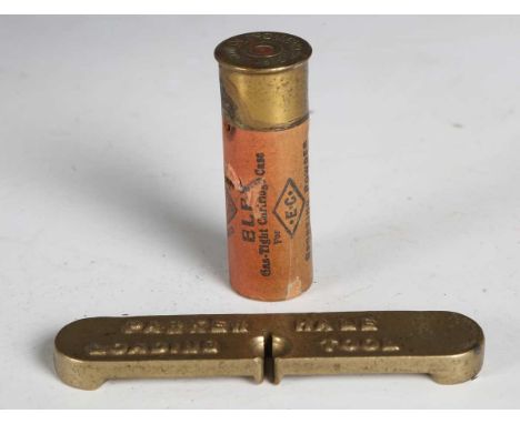 A scarce Parker Hale brass gun loading tool, length 9.5cm, together with an Eley salesman's sample cartridge, the body with s