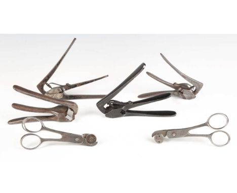 A group of four late 19th century pincer action cartridge redecapping tools, including examples stamped '20' and '400', toget