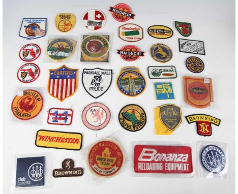 A large collection of 20th cloth and other badges relating to overseas shooting, game hunting and other related advertising, 