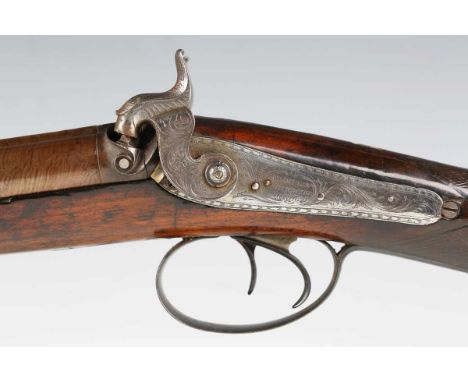 A fine mid to late 19th century double-barrelled percussion shotgun by Champion, Chichester, with round Damascus steel barrel