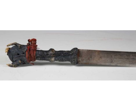 An unusual late 19th century Sudanese Mahdist kaskara sword with straight double-edged blade with embossed decoration, blade 