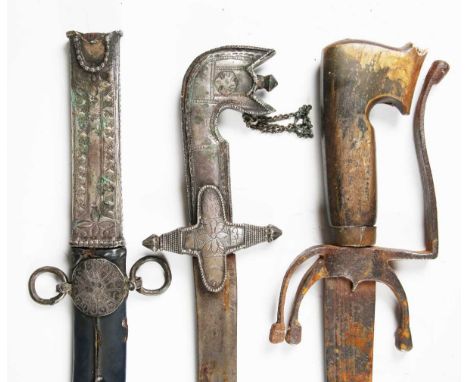 A late 19th century Arabian saif sword with single-edged fullered blade, blade length 79cm, together with an early 20th centu