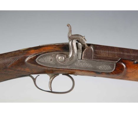 A 19th century single-barrelled percussion shotgun with part-round and part-octagonal Damascus steel barrel, barrel length 10