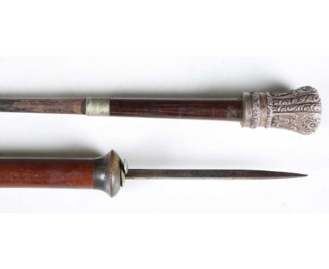 A late 19th century swordstick with part-blued diamond-section blade, blade length 70cm, rosewood handle and silver pommel wi