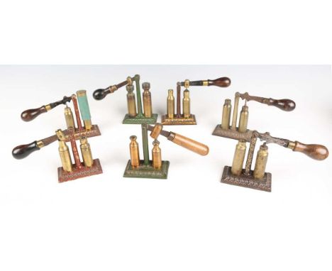 A group of seven late 19th century pillar style cartridge redecapping tools by James Dixon &amp; Sons, some unnamed but all i