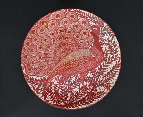 William de Morgan, an Arts and Crafts double lustre charger, circa 1890, painted with a peacock in profile in full plumage, o