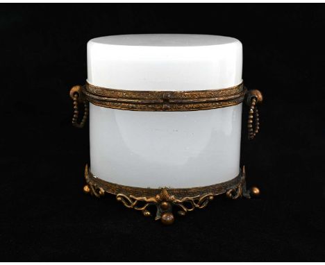 A French Palais Royale opaline glass trinket box, circa 1850s, oval section alabaster glass with gilt metal mounts and twin h