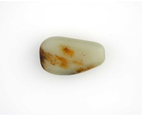A Chinese polished jade snuff bottle, tapered pebble form with rust inclusions and striations, 6.5cm