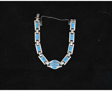 Murrle Bennett, an Arts and Crafts silver and enamelled bracelet, central Celtic knot in pale blue champleve enamel between r