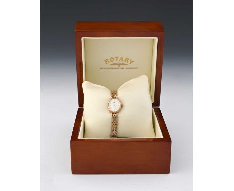 Rotary, a ladies 9 carat gold wristwatch with gold bracelet strap, oval white enamelled dial, in original box, 17g