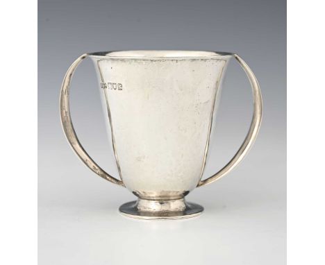 An Arts and Crafts silver twin handled footed cup, Henry Hodson Plante, London 1913, planished flared conical form with arche